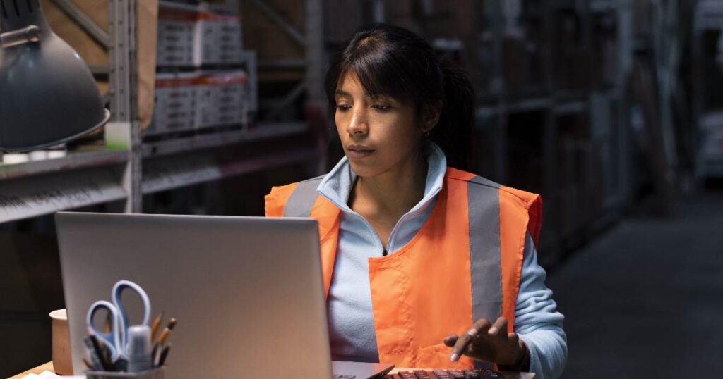 Employee working in poor workplace lighting conditions