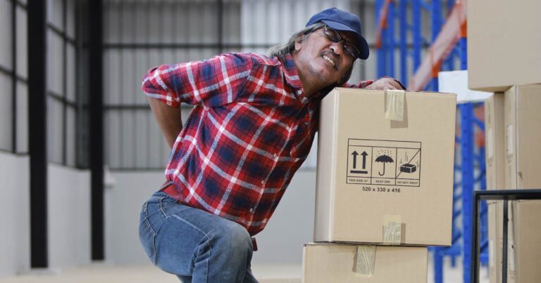 Worker experiencing back injuries at work