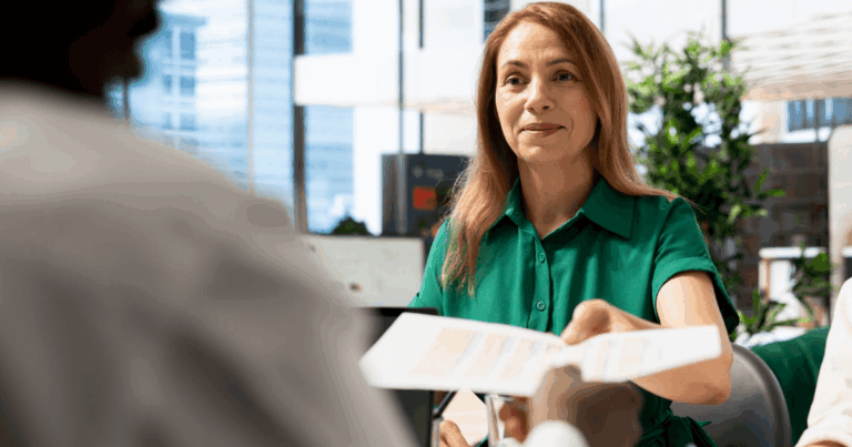 As part of the vocational rehabilitation service, a worker is handing her resume in an interview, trying to find a new job with suitable duties after her work injury