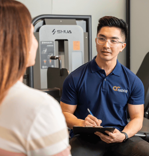AusRehab consultant discussing workplace rehabilitation steps after an Initial Needs Assessment, including return-to-work planning and ongoing review.