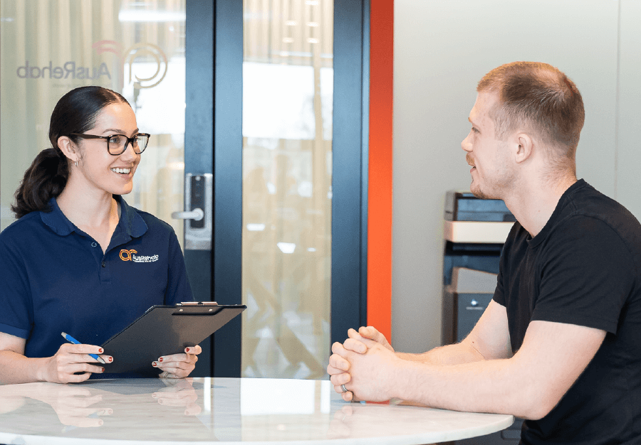 Workplace rehab consultant conducting job task analysis consultation with worker